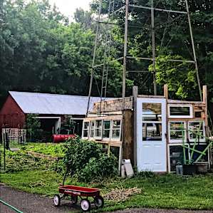 Awesome greenhouse built under the weathervane