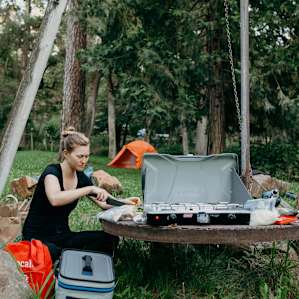 Prepping dinner out at the firepit.