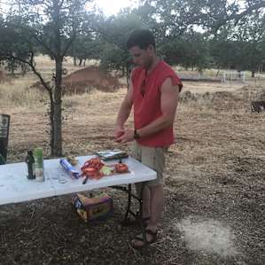 Making dinner at one of the designated cooking spots -- complete with grills, tables, chairs, and trees to hang a hammock from!