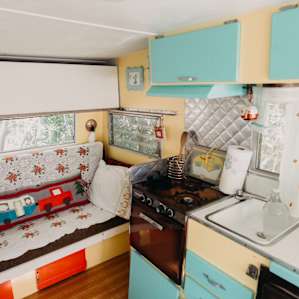 A bright, adorable space! The couch deconstructs into a bed!