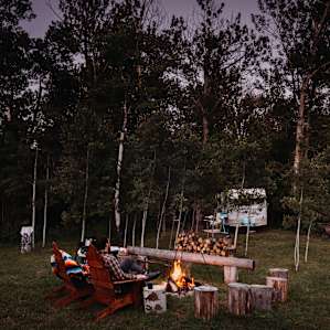 Relaxing at the campfire and listening to the nearby river.