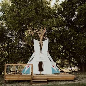 Tent is spacious and elevated on a wooden deck. Chairs & table to sit at and drink coffee in the morning.