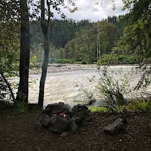 There was a fire pit in front of the river