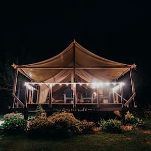 The Safari Tent lit up at night!