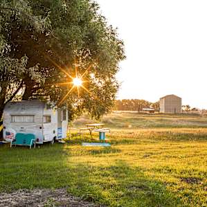 vintage camper at sunrise