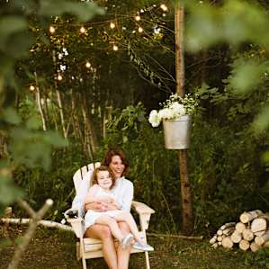 The extra fireside chair and hanging fresh cut flowers just show the host's attention to detail.