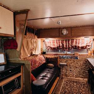 The cozy living room with TV.