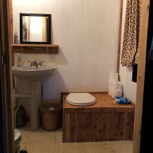 Outhouse with running water.