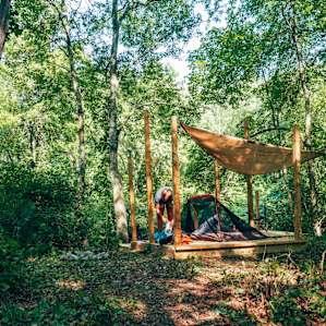 Platform, camp chair, fire ring, and the river creating a perfect little nook to spend the night