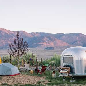 The airstream is perched at the front of the property (my tent is the grey one, the yellow one is another camper's site.) You can park right beside.