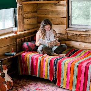 Bed in the first room of the cabin