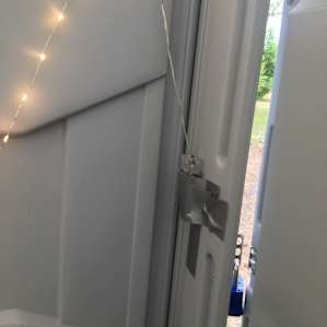 Clever way to help light the outhouse at night