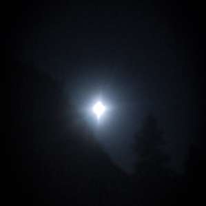 Full moon rising over the bluff next to the farm.