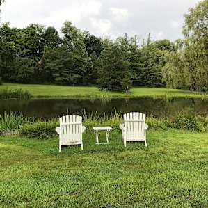 pond and chairs