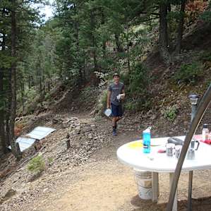 Hauling water up the hill to the site.