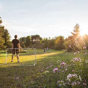 A soccer ball and nets are available for play.