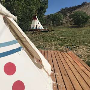 Front of the tipis and the nice little platform with a little sitting area. (That I was sitting in so you can't see the table and chairs in this photo.)