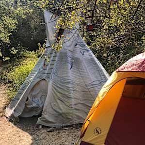 Our tipi (16') — we had 5 girls, and decided to pitch a tent so we had plenty of room for our things and to sleep.