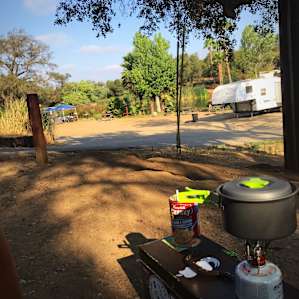 I have a picnic table but just like to be next to my as everything is handy if I need somethings quick while cooking my breakfast (can soup) on top of my tool box.