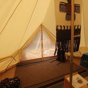Our last day & some of our things packed. Inside tent looking out