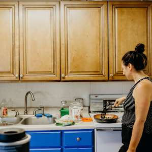 cooking breakfast in the communal kitchen.