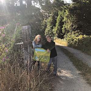 Our kids posing by the driveway entrance sign.