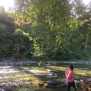 Hot spring pool next to cool river.