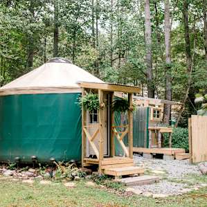 Looking out over all parts of the yurt property - with outdoor restroom and shower in the background