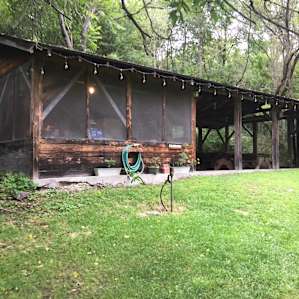 Kitchen portion of the pavilion. Screened in and comfy.
