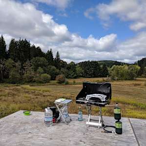 The platform right next to cabin 1 was perfect for setting up a couple of camp chairs and cooking our eggs in the morning while enjoying the view of the meadow.