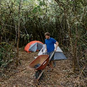 The plum/blackberry orchard we set up our tent in. It was a short walk to the car from here, but Mariah offered use of a wheelbarrow to move things around with.