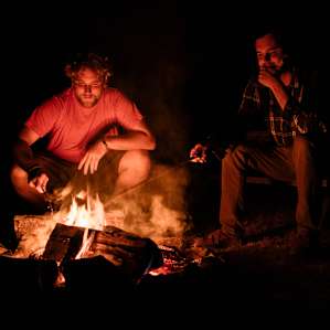 Poking at fires with a stick. Always fun. Doesn't matter how old you are.