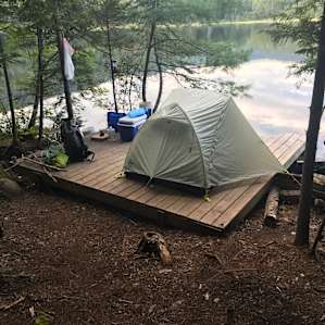 Our two-person tent on the platform. We had to get a little creative with rope in order to tie the rain fly down. Fireplace is off to the left.