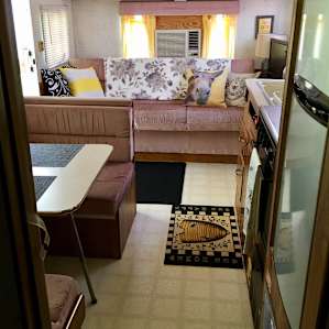 the long view into the living area from the bathroom, bedroom behind that