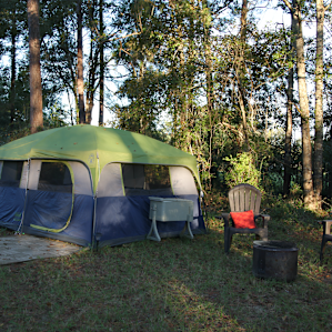 Large tent with firepit and seating