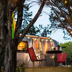 I'm a sucker for this magical fairy lights strung up around the airstream!