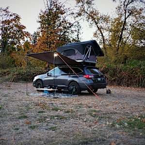 Where we pitched our roof top tent, just on the other side of the river, separated by a thin veil of trees and bushes.