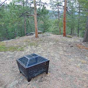 The firepit and the swing overlook a beautiful vista.