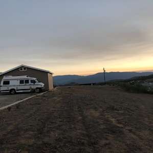 The hook up are on the side of the detached garage, we had a view of the sunrise and sunset as well as the goats and chickens. Our spot was private and quiet. Very relaxing.