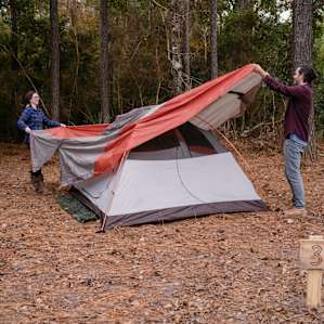Setting up tent, at one of the further sites. Coyotes and owls let us know we're still in the woods at night.