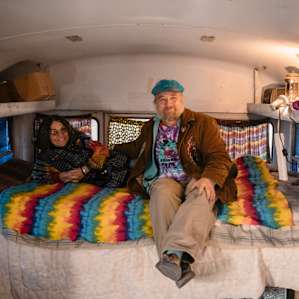 Their old home, a living bus, is parked on the property.