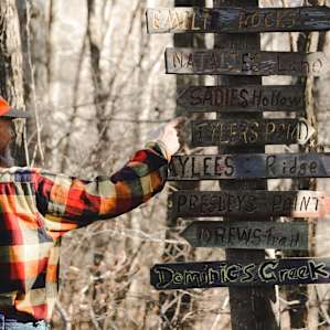 An adorable sign helps direct visitors to different parts of the property.