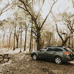 The campsite has everything you need--from picnic tables, to chairs, to lanterns, and a shower.