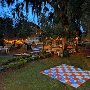 The hot tub area under the giant tree complete with a swing and decorations