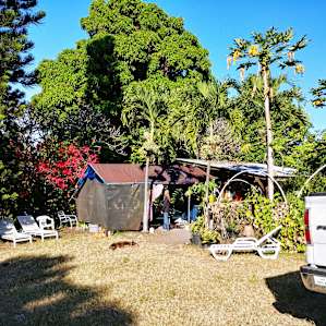 wide view of kitchen/common area - rain and sun protected but airy.