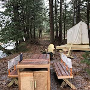 Beautiful campsite next to a tranquil river in the New Hampshire woods
