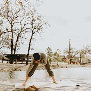 Stretching after the long car ride. Bring your yoga mat and do some sunrise yoga on the little dock!