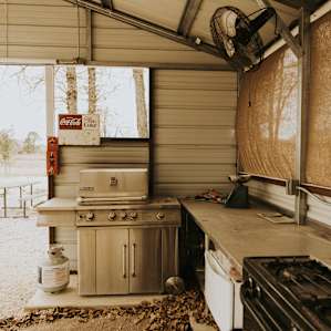 The outdoor kitchen area is available for use and even has an outdoor sink and grill!