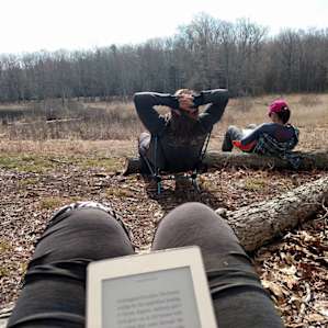 Relaxing -- READING! -- in camp.