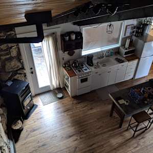 View from the loft looking down into the kitchen and living space.